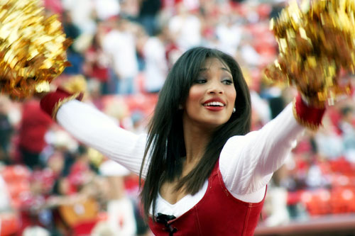 the hot cheerleader likes men with broad shoulders who know how to military press