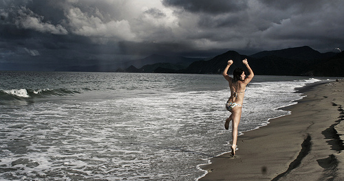 Workout Duration and Frequency Don’t Waste Your Life in the Gym babe on a beach